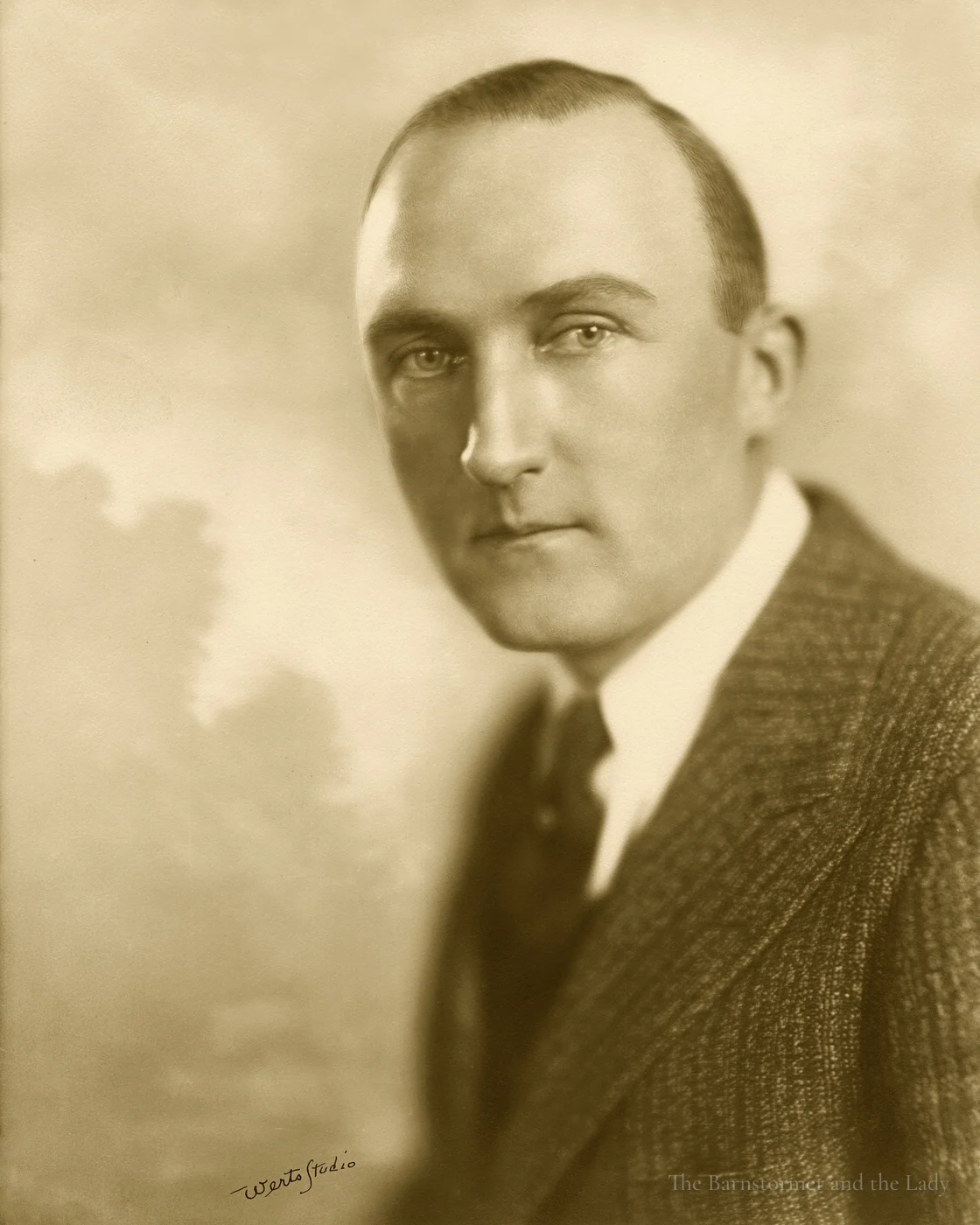 Studio portrait of Walter Beech in a tweed jacket and tie